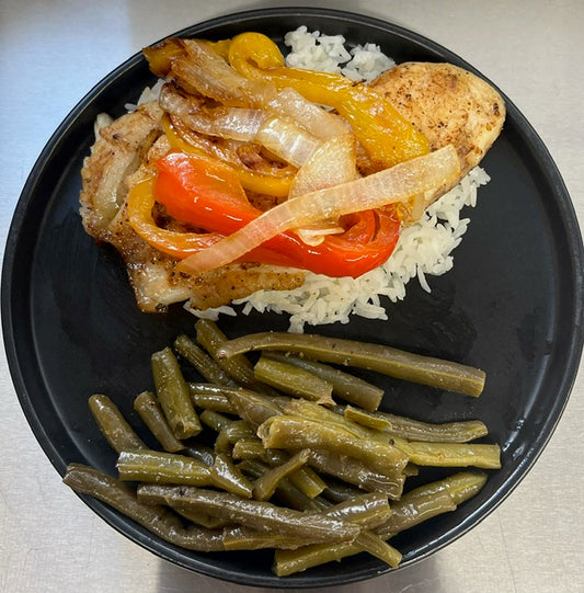 Blackened Fish Topped with Grilled Bell Peppers and Onions Over Rice with Broccoli